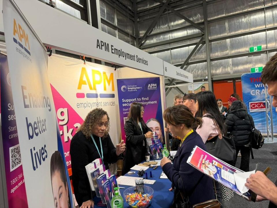 Visitors at an exhibitor stand, careers and training expo in Australia