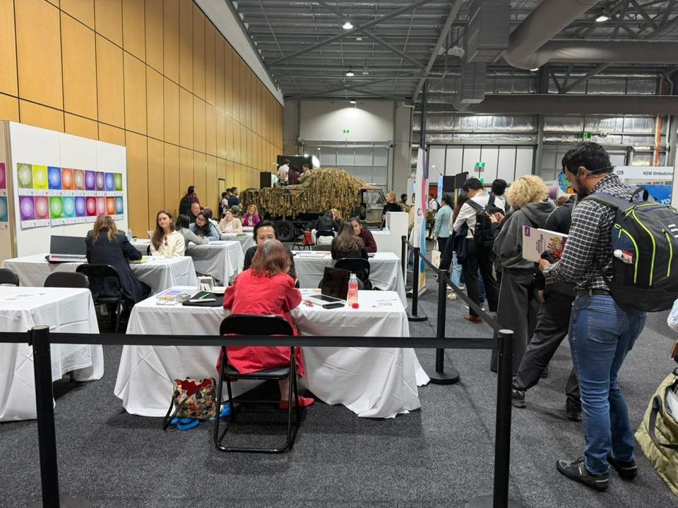 Consultation tables at a careers and training expo in Australia