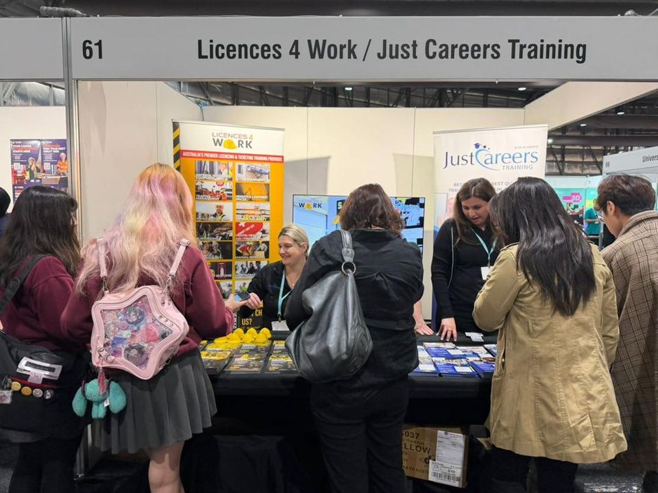 Visitors at an exhibitor stand, careers and training expo in Australia