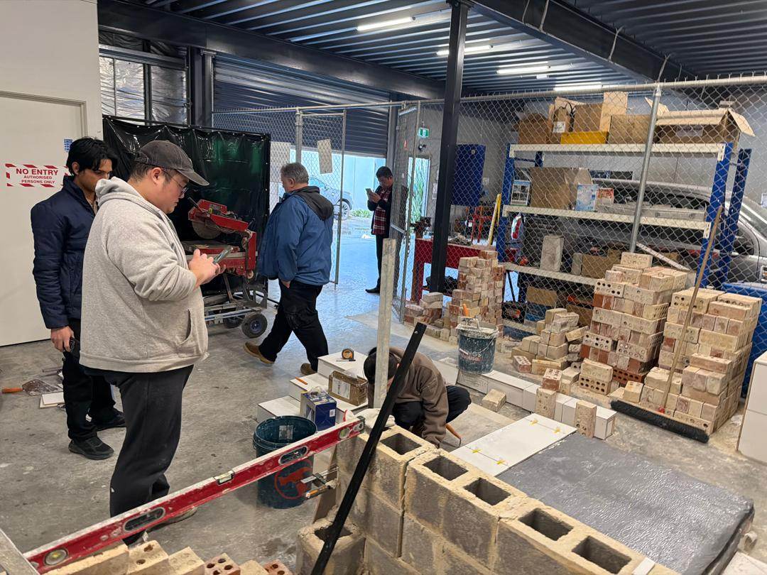 Trainees watching a construction trades demonstration at Signet Institute of Australia